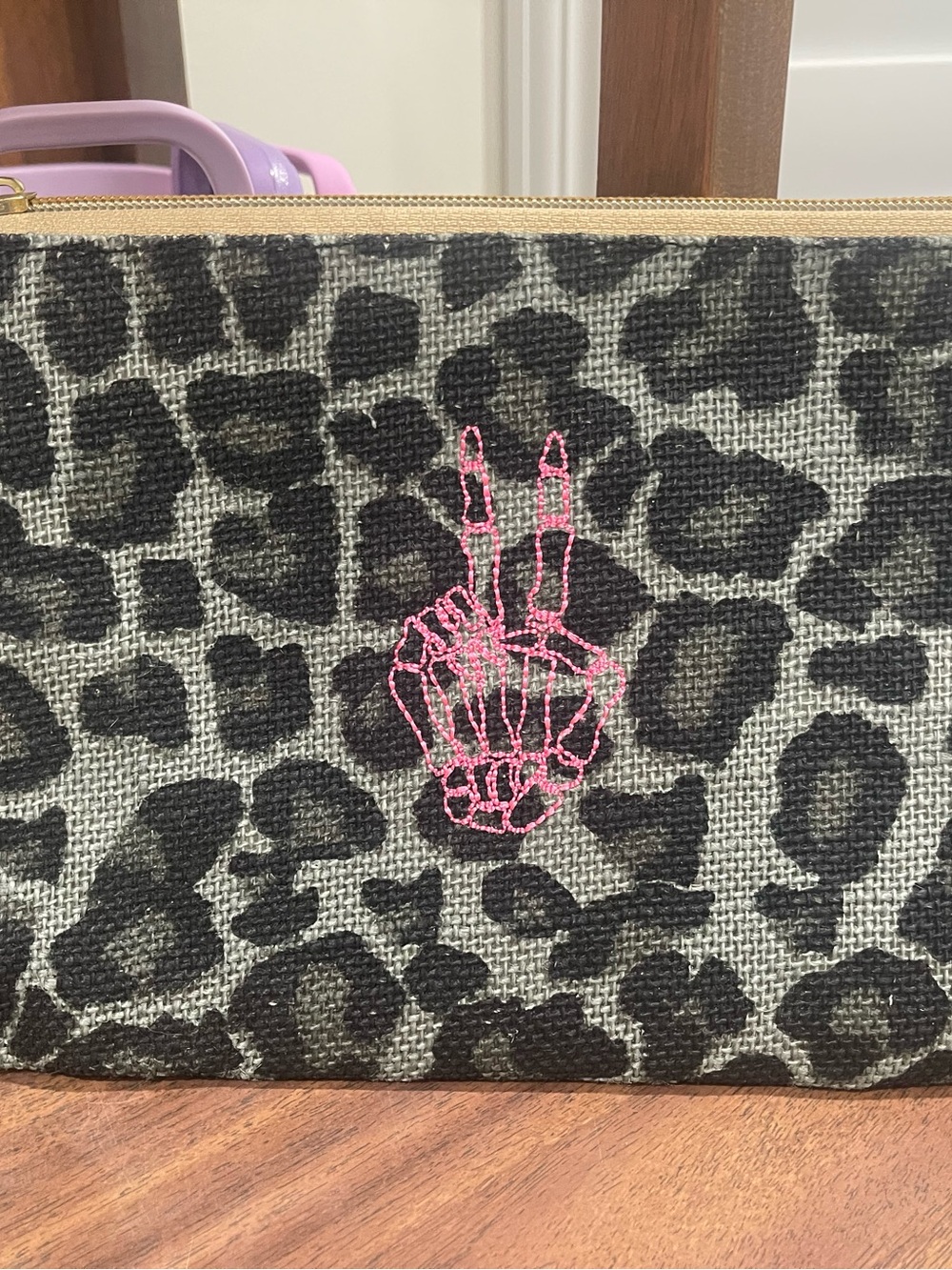 Leopard Print Wristlet Pouch with Pink Embroidered Skeleton Hand